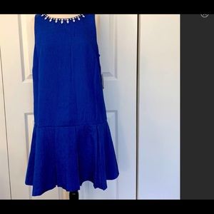 Beautiful Royal Blue dress with faux gems around collar. Bottom has a cute flare
